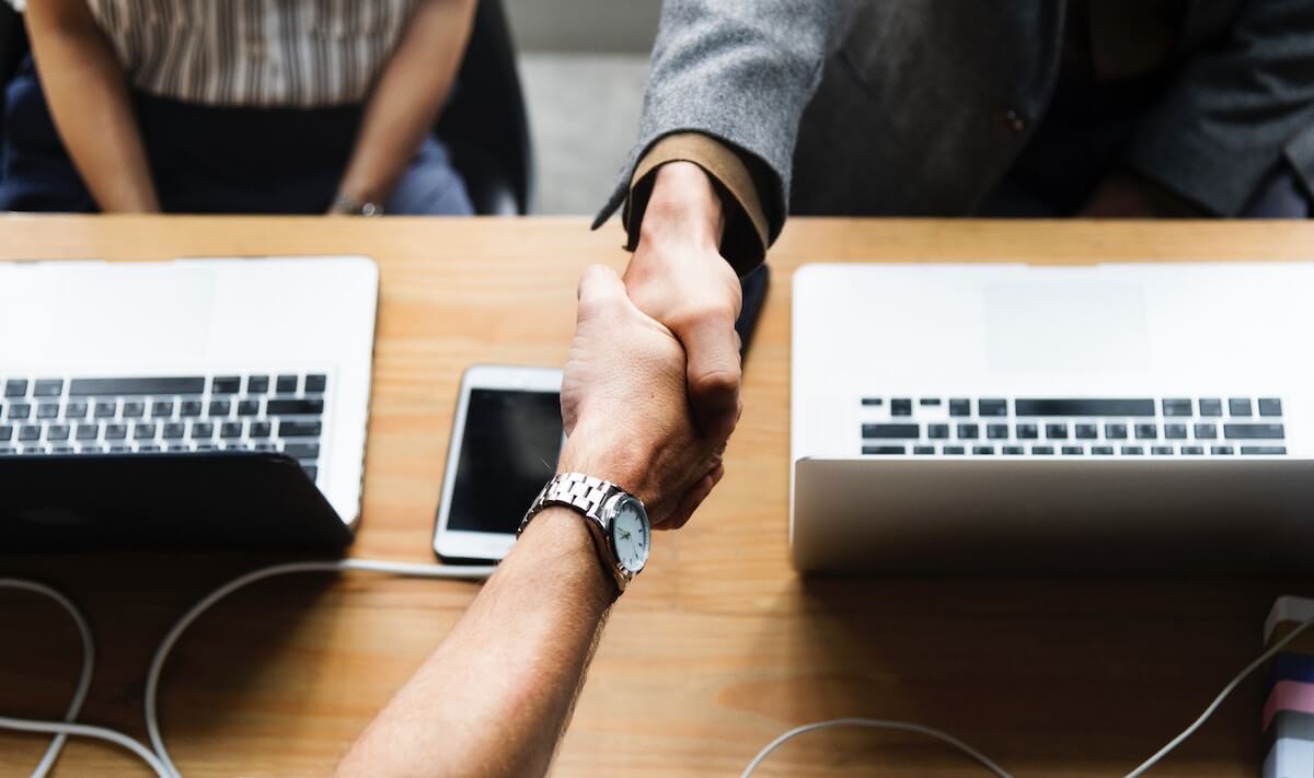 Two professionals shaking hands